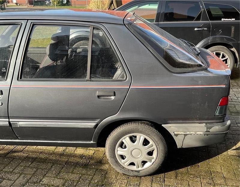 Gebraucht Peugeot 309 60 PS (44 kW) 1991 Grau Kleinwagen