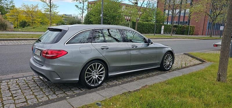 Silber Gebraucht 2015 Mercedes C200 AMG line Kombi | 17.999 € (Fairer Preis) - Bild 1/4