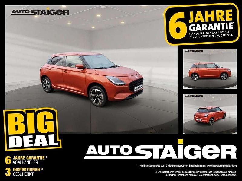 Burning red pearl metallic Neu 2025 Suzuki Swift Comfort Kleinwagen | 18.290 € - Bild 1/4