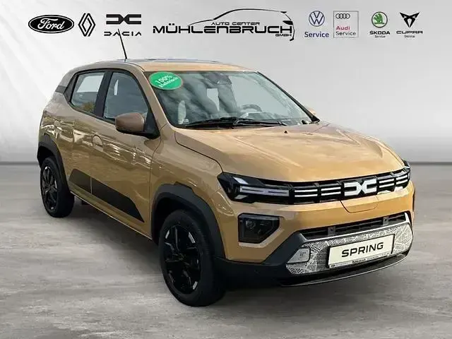 Gebraucht Dacia Spring Extreme 47 kW (65 PS) 2025 Safaribeige Kleinwagen