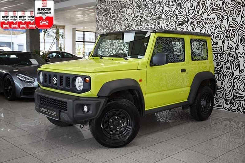 Kinetic yellow / bluish black Gebraucht 2021 Suzuki Jimny Comfort SUV | 30.880 € (Fairer Preis) - Bild 1/3