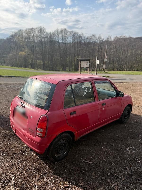 Gebraucht Daihatsu Cuore 56 PS (41 kW) 2002 Rot Kleinwagen