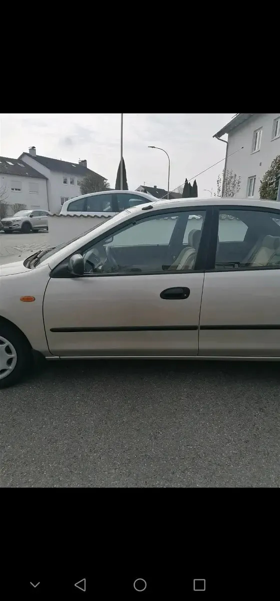 Second-hand Mazda 323 88 CP (64 kW) 1996 Bej Berlinǎ