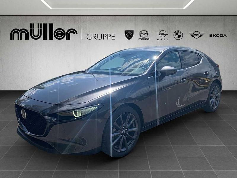 Machine gray Neu 2025 Mazda 3 Exclusive-Line Limousine | 28.407 € - Bild 1/4