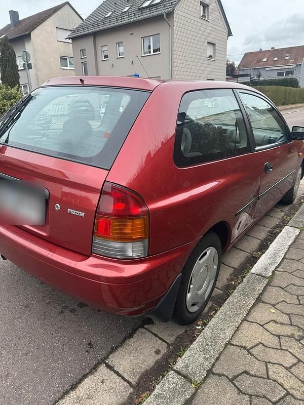 Gebraucht Mazda 323 88 PS (64 kW) 1997 Rot Kleinwagen