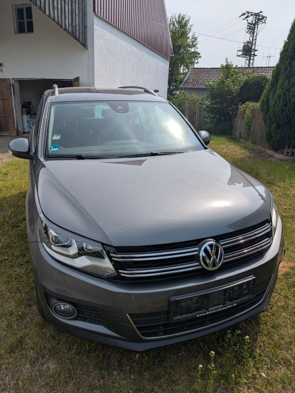 Grau Gebraucht 2015 VW Tiguan LOUNGE SUV | 18.500 € (Fairer Preis) - Bild 1/4
