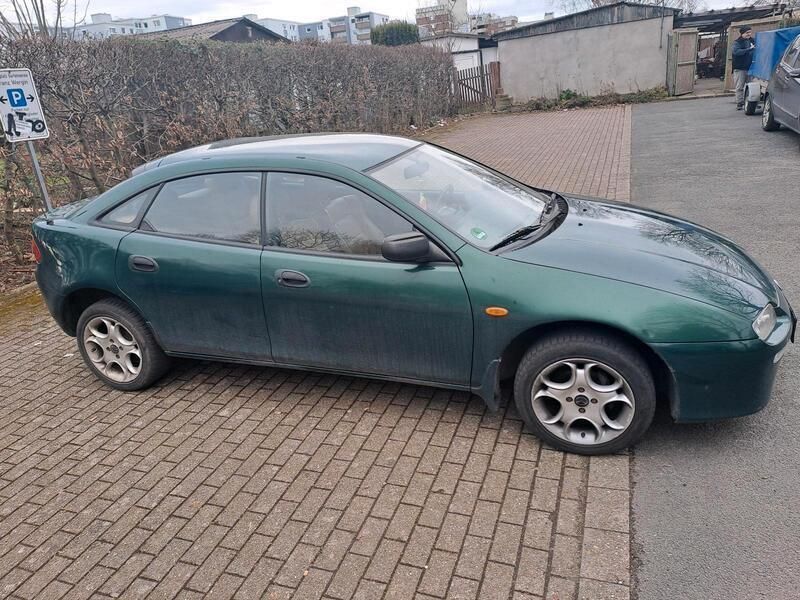 Grün Gebraucht 1998 Mazda 323F Limousine | 1.349 € - Bild 1/4