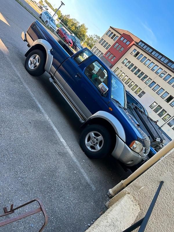 Blau Gebraucht 2004 Nissan Navara Abholung | 10.600 € (Fairer Preis) - Bild 1/4