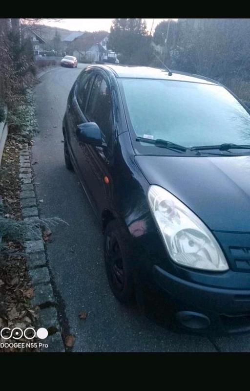 Gebraucht Nissan Pixo 68 PS (50 kW) 2010 Schwarz Kleinwagen
