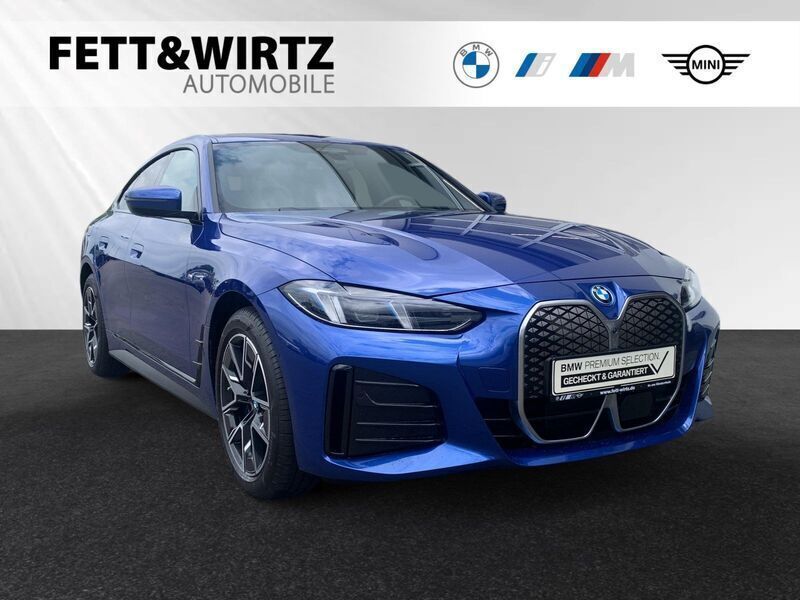 Portimao blau metallic Gebraucht 2024 BMW i4 Comfort Edition Limousine | 46.500 € (Superpreis) - Bild 1/3