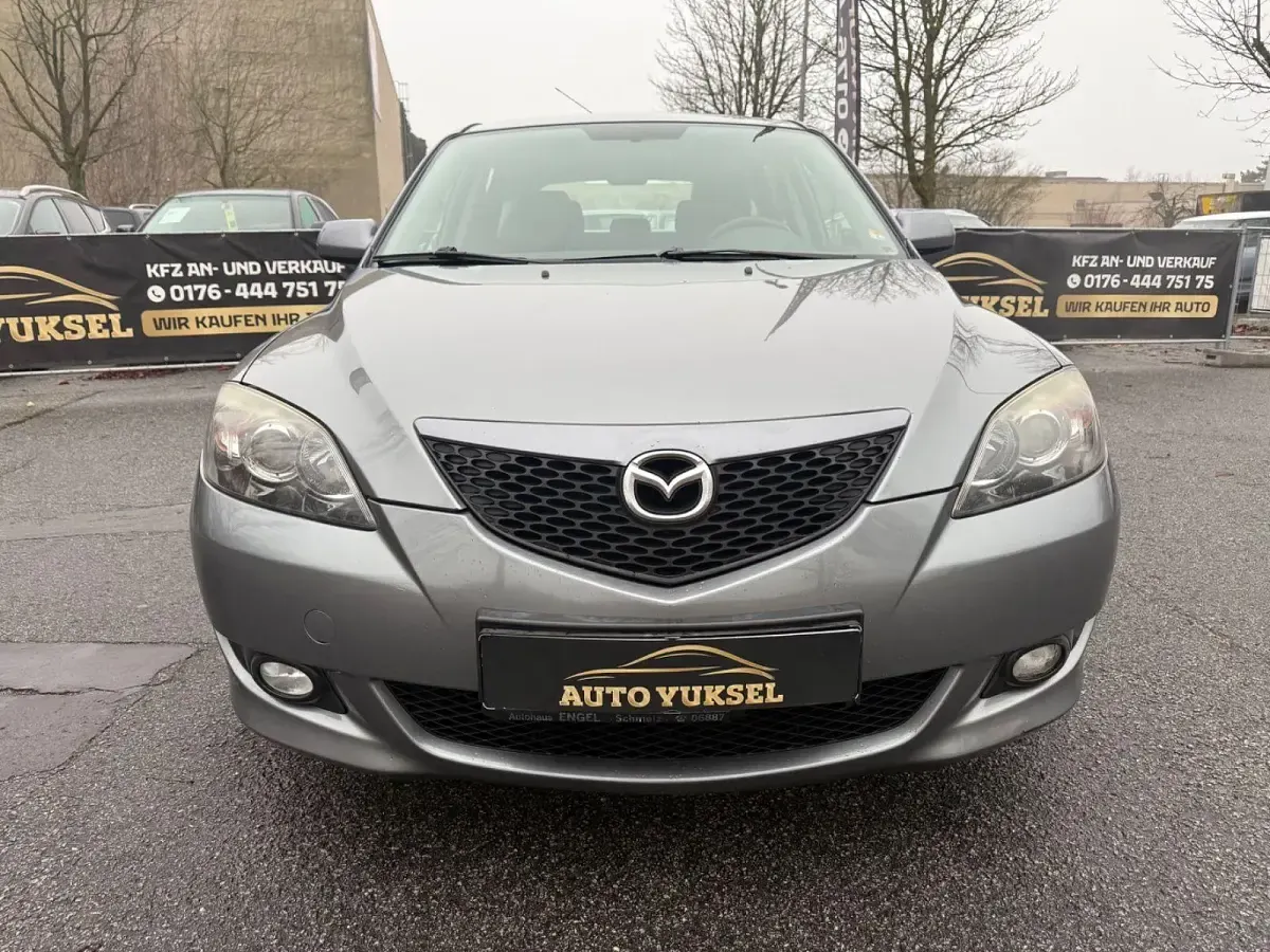 Używany Mazda 3 Comfort 105 KM (77 kW) 2004 Szary Sedan/Limuzyna