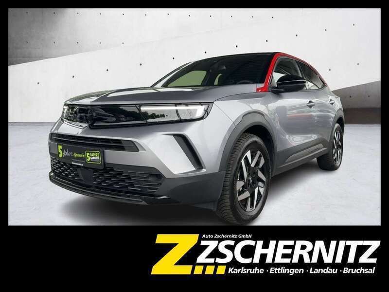 Lack grau artense/typ aussenve Gebraucht 2023 Opel Mokka-e GS Line SUV | 18.860 € (Superpreis) - Bild 1/4