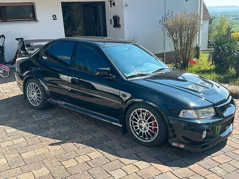 Second-hand Mitsubishi Lancer Evolution 300 CP (220 kW) 2000 Negru Berlinǎ