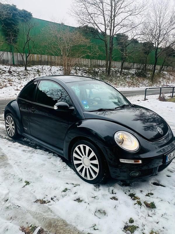 Gebraucht VW New Beetle 102 PS (75 kW) 2010 Schwarz Kleinwagen