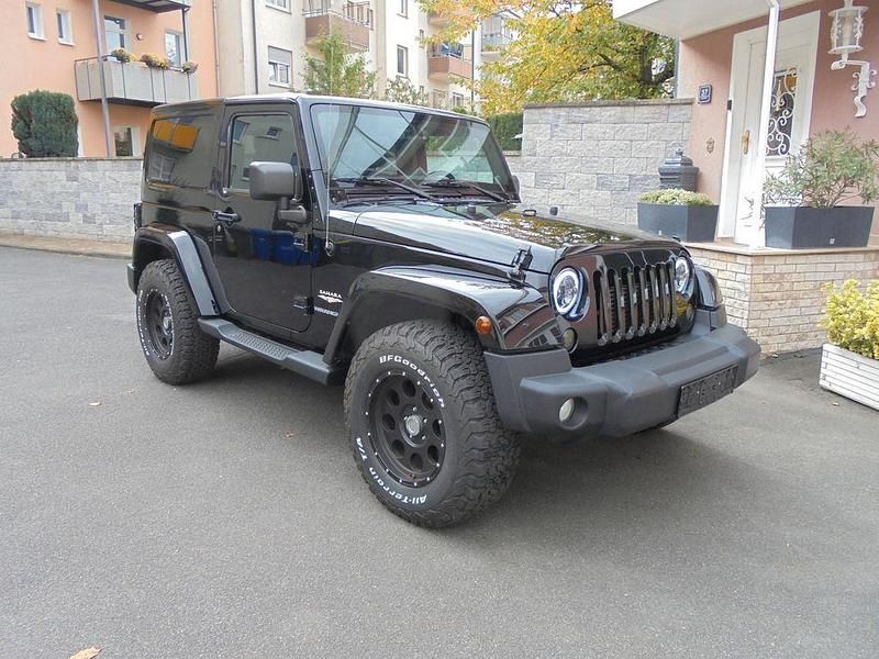 Black clear coat Gebraucht 2013 Jeep Wrangler Sahara SUV | 24.990 € (Fairer Preis) - Bild 1/4