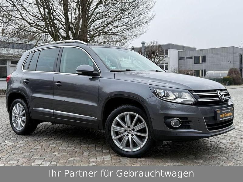 Grau Gebraucht 2013 VW Tiguan Sportline SUV | 12.290 € (Fairer Preis) - Bild 1/4