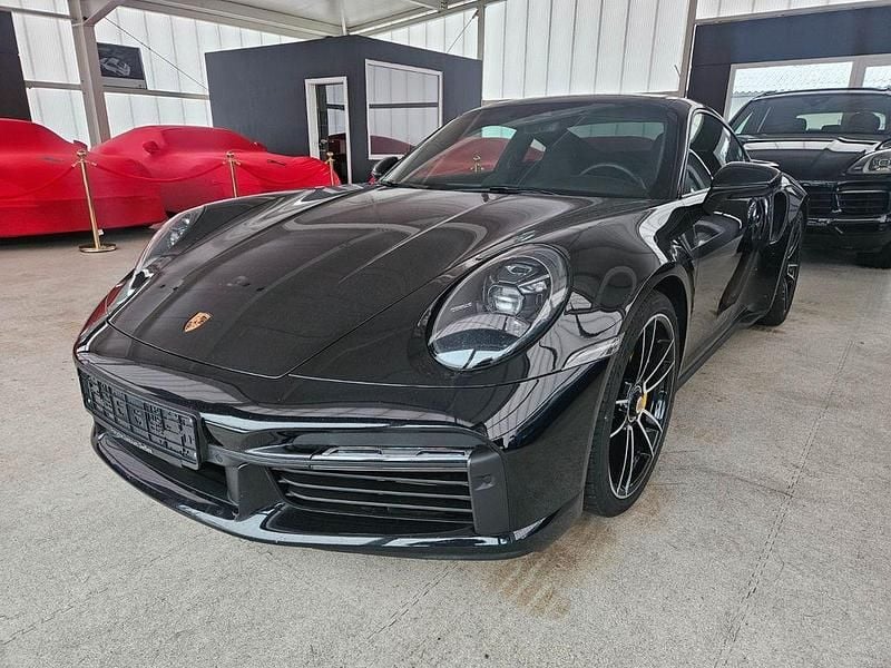 Schwarz Gebraucht 2024 Porsche 992 Coupé | 214.800 € - Bild 1/4