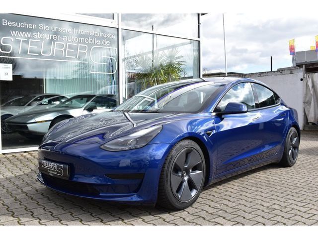 Blau Gebraucht 2021 Tesla Model 3 Standard Range Plus Limousine | 35.890 € - Bild 1/1