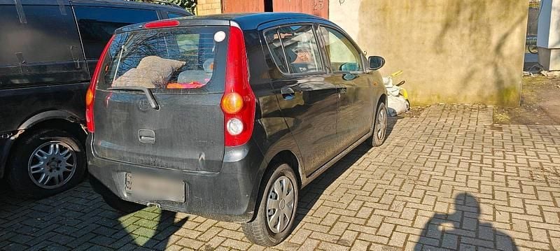 Gebraucht Daihatsu Cuore 70 PS (51 kW) 2010 Schwarz Kleinwagen