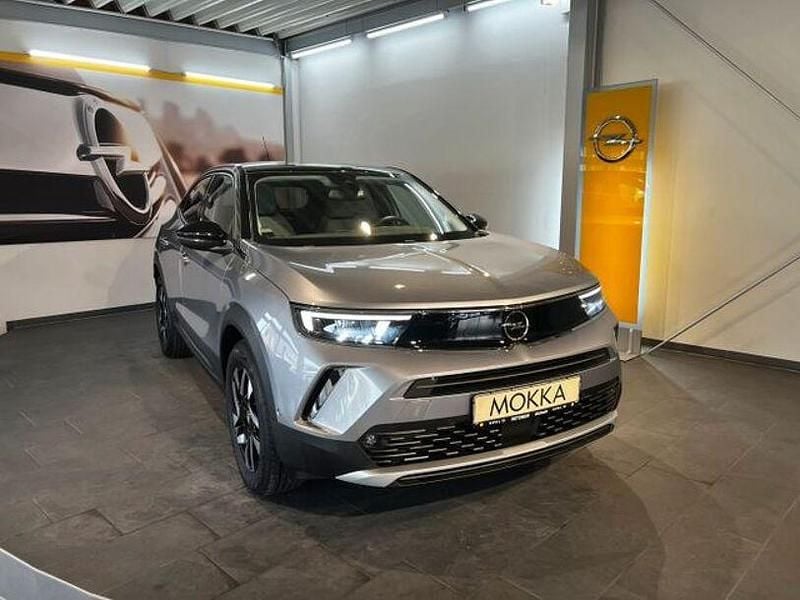 Kontrast grau (metallic) Gebraucht 2023 Opel Mokka-e Elegance SUV | 19.890 € (Fairer Preis) - Bild 1/4