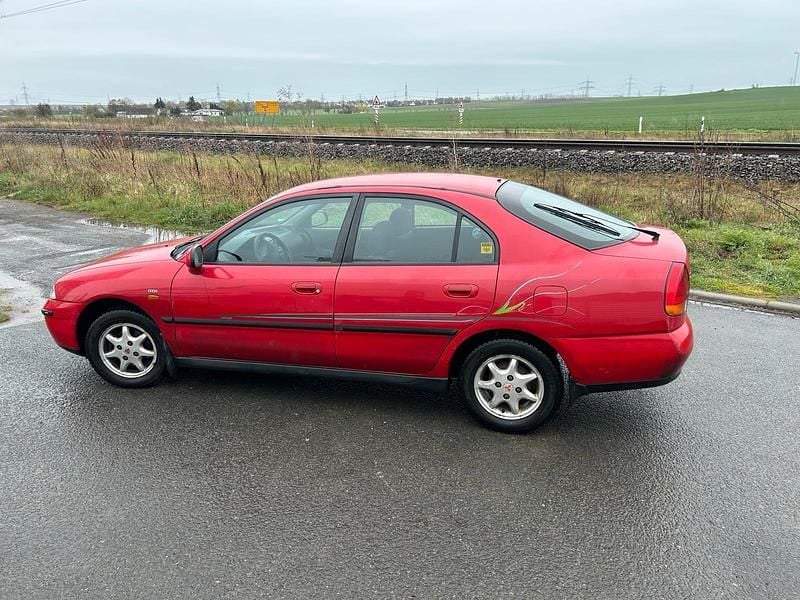 Gebraucht Mitsubishi Carisma 125 PS (91 kW) 1998 Rot Limousine