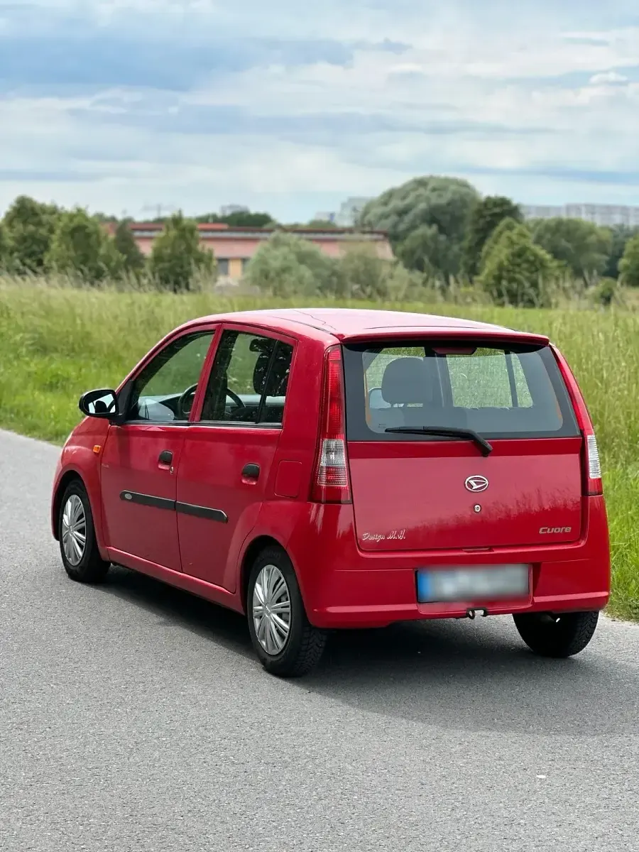 Gebraucht Daihatsu Cuore 60 PS (44 kW) 2004 Rot Kleinwagen