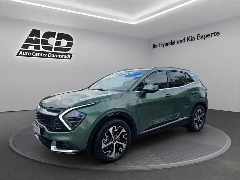 Experience green (metallic) Gebraucht 2024 Kia Sportage Spirit SUV | 31.877 € (Fairer Preis) - Bild 1/4
