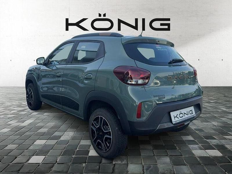 Gebraucht Dacia Spring Extreme 47 kW (65 PS) 2023 Grün "flechtengrau" Kleinwagen