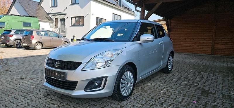 Silber Gebraucht 2015 Suzuki Swift Kleinwagen | 6.600 € - Bild 1/4