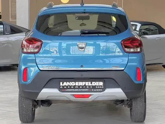 Gebraucht Dacia Spring Comfort Plus 50 kW (68 PS) 2022 Morgenbrisenblau Kleinwagen