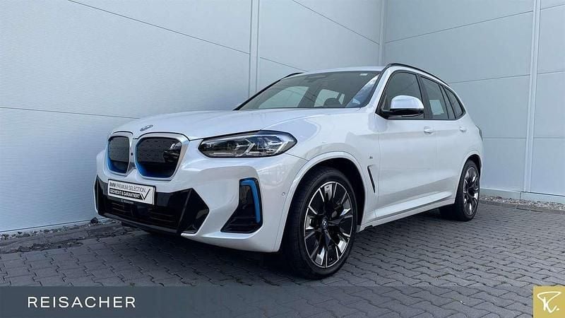Mineralweiß metallic Gebraucht 2024 BMW iX3 Impressive SUV | 50.749 € (Superpreis) - Bild 1/4