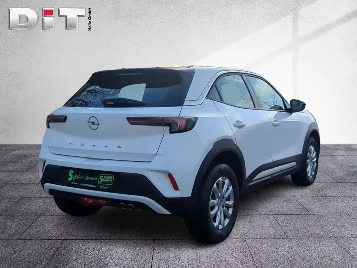 Gebraucht Opel Mokka Enjoy 131 PS (96 kW) 2023 Lack weiss banquise/typ aussenverkleidun (metallic) SUV