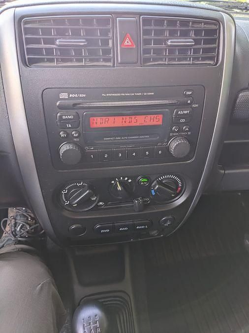 Grau Gebraucht 2010 Suzuki Jimny Comfort SUV | 8.400 € (Fairer Preis) - Bild 1/4