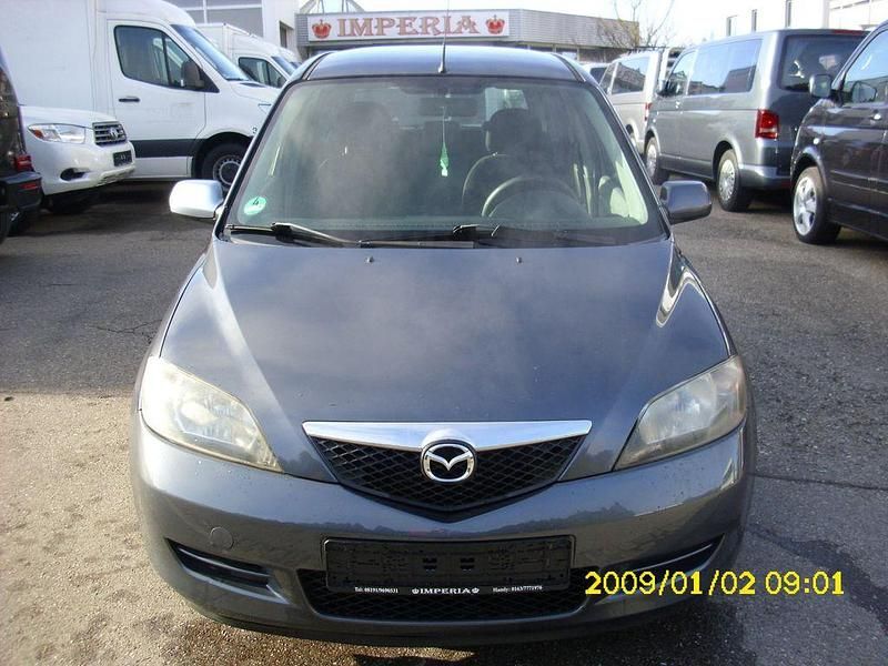 Grau Gebraucht 2005 Mazda 2 Active Limousine | 1.499 € (Fairer Preis) - Bild 1/4