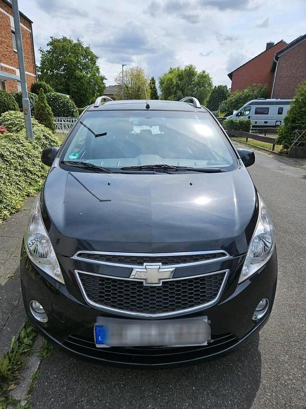 Schwarz Gebraucht 2012 Chevrolet Spark Kleinwagen | 2.400 € (Fairer Preis) - Bild 1/4