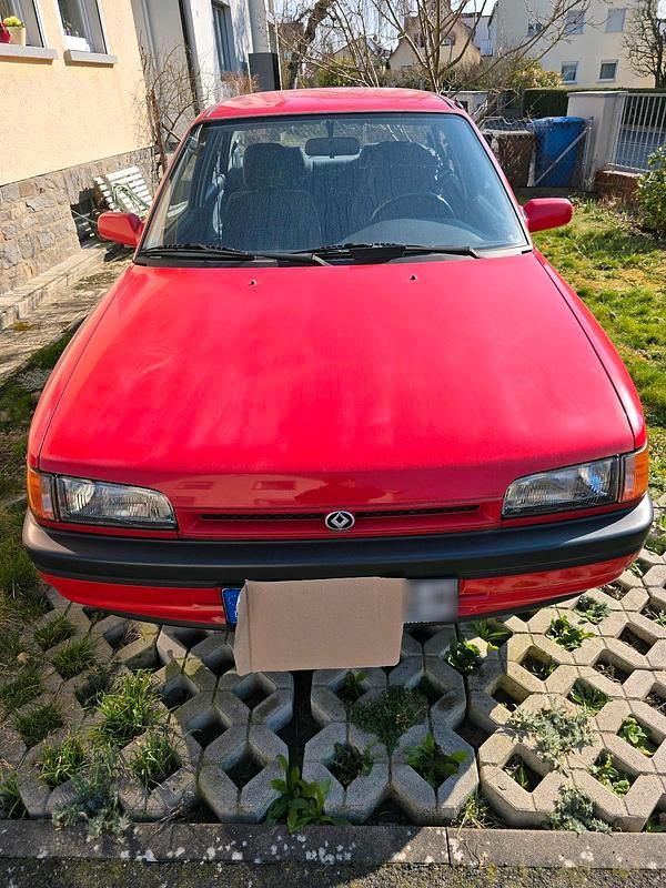 Gebraucht Mazda 323 90 PS (66 kW) 1989 Rot Limousine