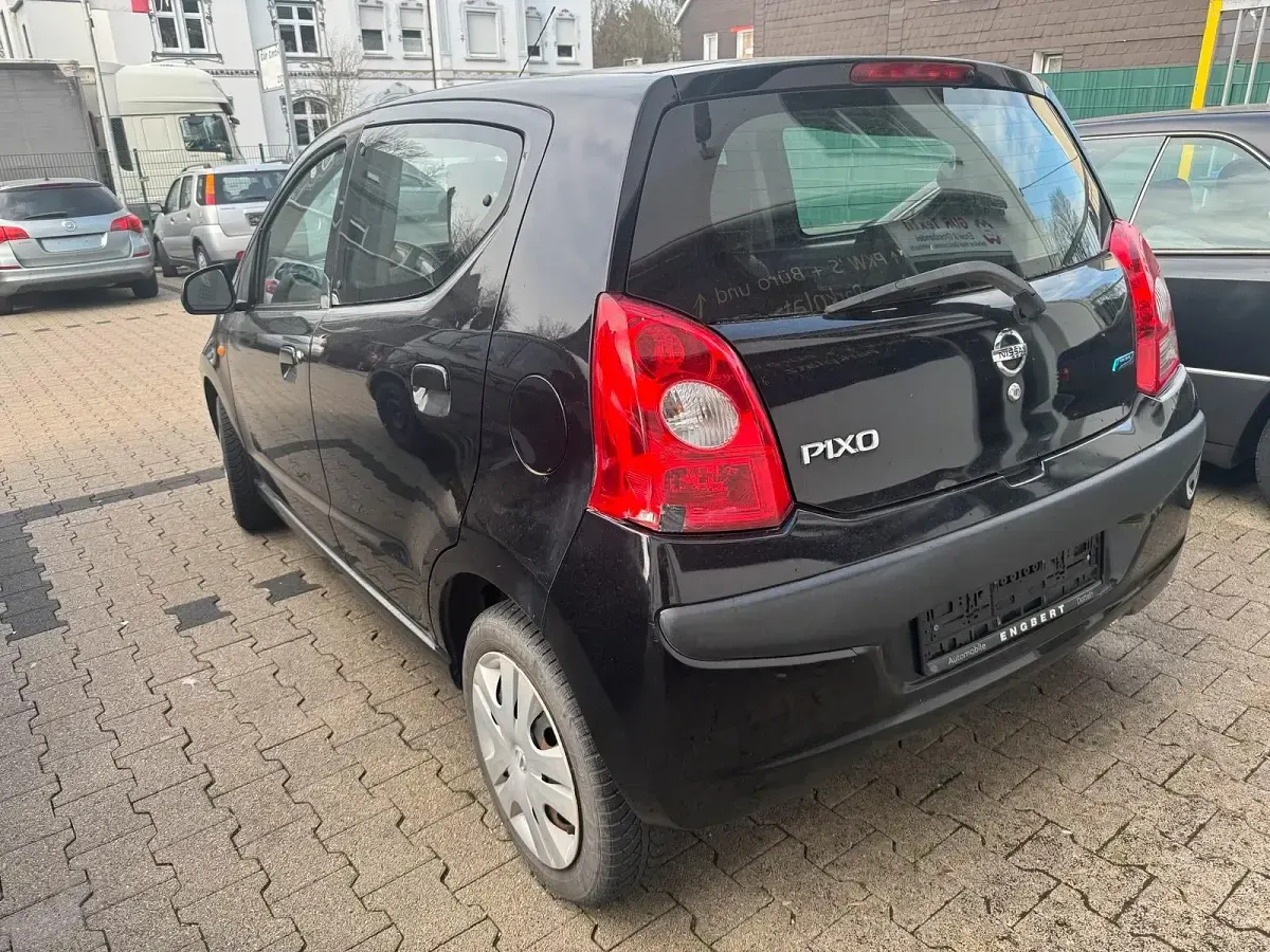 Gebraucht Nissan Pixo 67 PS (49 kW) 2009 Schwarz Kleinwagen