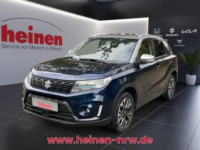 Grau Gebraucht 2024 Suzuki Vitara Comfort+ SUV | 21.899 € (Etwas zu teuer) - Bild 1/4