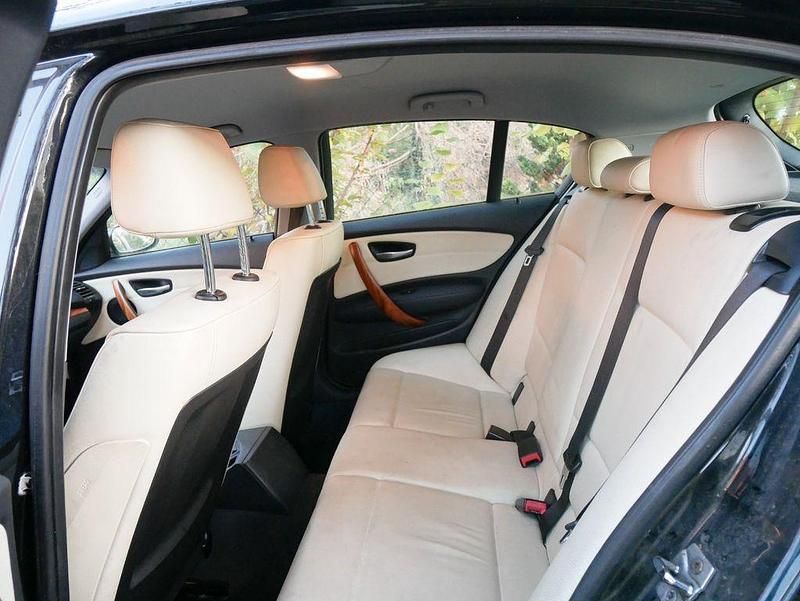 Second-hand BMW 118 143 CP (105 kW) 2009 Negru Hatchback