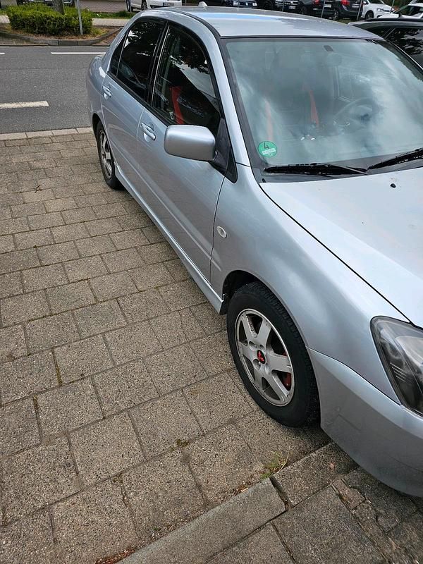 Second-hand Mitsubishi Lancer 95 CP (69 kW) 2004 Gri Berlinǎ