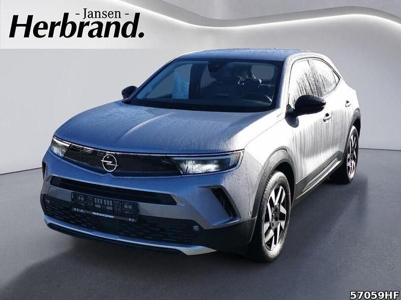 Gebraucht Opel Mokka-e Elegance 100 kW (136 PS) 2022 Kontrast grau/quarz silber SUV