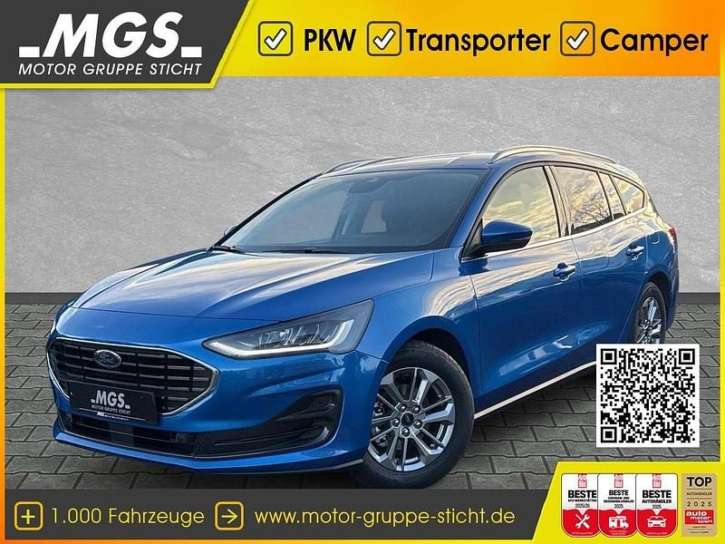 Desert island blue metallic Neu 2025 Ford Focus Titanium Limousine | 32.325 € (Fairer Preis) - Bild 1/4