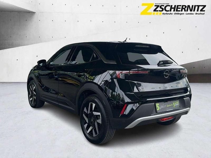 Gebraucht Opel Mokka-e Elegance 100 kW (136 PS) 2023 Lackierung schwarz perla nera/ SUV