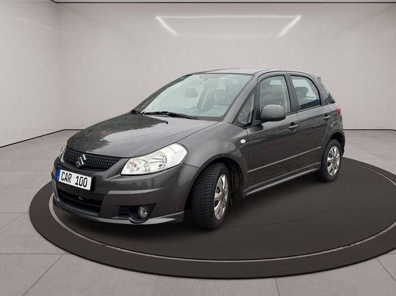Grau Gebraucht 2010 Suzuki SX4 City Limousine | 4.999 € (Fairer Preis) - Bild 1/4