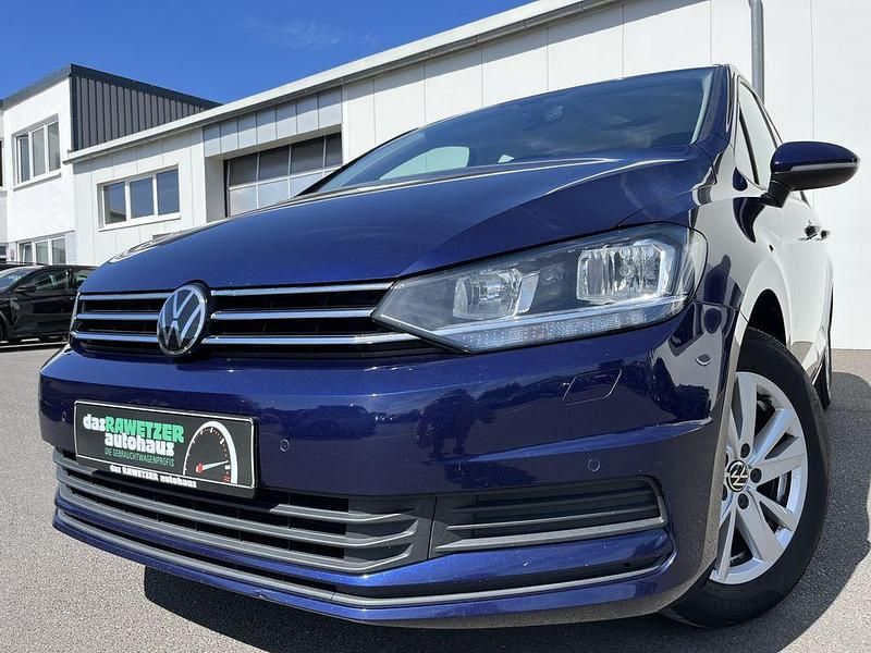 Blau Gebraucht 2021 VW Touran Comfortline Van / Kleinbus | 19.860 € (Fairer Preis) - Bild 1/4