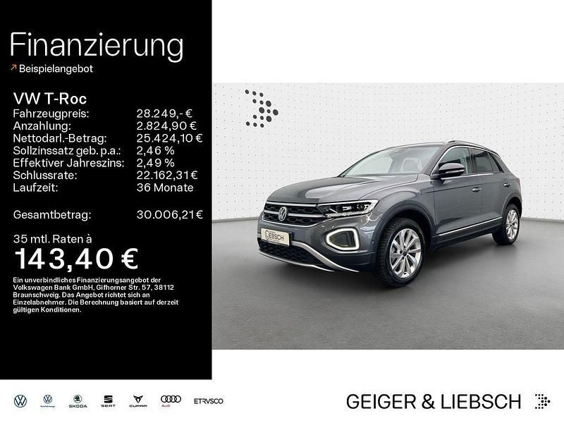 Indiumgrau metallic/schwarz Gebraucht 2024 VW T-Roc Style SUV | 28.249 € (Guter Preis) - Bild 1/4