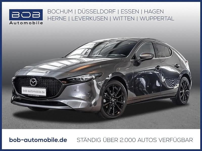 Grau Gebraucht 2024 Mazda 3 Exclusive-Line Limousine | 26.809 € (Fairer Preis) - Bild 1/3