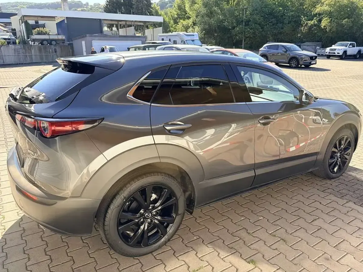 Gebraucht Mazda CX-30 Homura-Line 186 PS (136 kW) 2023 Machine grey SUV