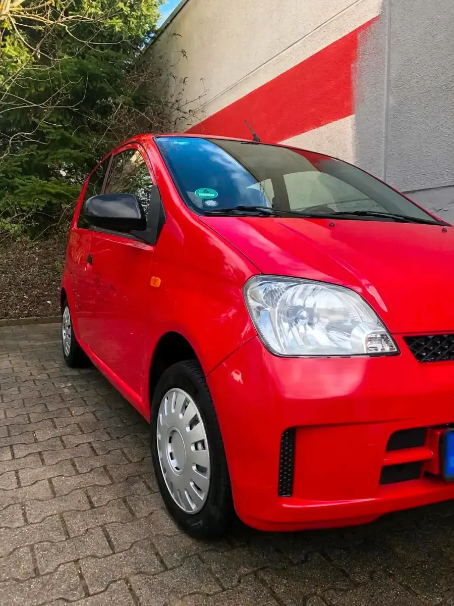 Gebraucht Daihatsu Cuore 54 PS (39 kW) 2004 Rot Kleinwagen