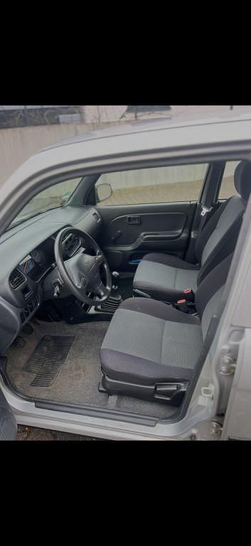 Gebraucht Daihatsu Cuore 58 PS (42 kW) 2003 Silber Kleinwagen